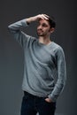 Portrait of young handsome male with beard wearing blouse