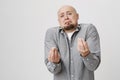 Portrait of young handsome man with a beard showing italian gesture that means what do you want over white background