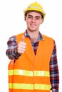 Portrait of young handsome man construction worker giving thumbs up Royalty Free Stock Photo