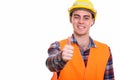 Portrait of young handsome man construction worker giving thumbs up Royalty Free Stock Photo