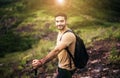 Portrait of young handsome man holding trekking pole at nature,Happy and smiling,Travel at outdoor Royalty Free Stock Photo