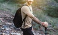 Portrait of young handsome man holding trekking pole at nature,Happy and smiling,Travel at outdoor,Close up Royalty Free Stock Photo