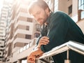 Portrait of young handsome man posing outdoors