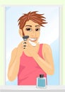 Portrait of young handsome man shaving