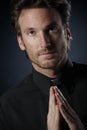 Young priest praying to God Royalty Free Stock Photo