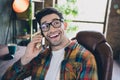 Portrait young handsome programmer man makes a phone call talking to client in office listen request for new product on Royalty Free Stock Photo