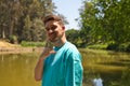 Portrait young and handsome red-haired man, happy, smiling, making the call me sign with his hand or surfer sign. Positive human Royalty Free Stock Photo