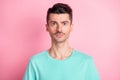 Portrait of young handsome serious man with brown hair and mustache look camera isolated on pink color background Royalty Free Stock Photo