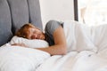 Portrait of young handsome sleeping redhead man in gray t-shirt Royalty Free Stock Photo