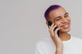 Portrait of young handsome smiling boy talking phone looking aside Royalty Free Stock Photo