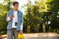 Portrait of young handsome smiling stylish boy in glasses Royalty Free Stock Photo