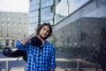 Portrait of young handsome stylish man on the street. Guy in the blue shirt Royalty Free Stock Photo