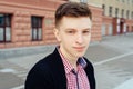 Portrait of young handsome trendy smiling man in plaid shirt. Royalty Free Stock Photo