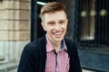 Portrait of young handsome trendy smiling man in plaid shirt Royalty Free Stock Photo