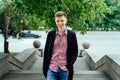 Portrait of young handsome trendy smiling man in plaid shirt. Royalty Free Stock Photo