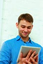 Portrait of a young hapiness businessman holding tablet computer