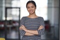 Portrait of a young happy asian woman, female office worker in casual clothes keeping arms crossed, looking at camera Royalty Free Stock Photo