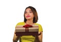 Portrait of young happy and beautiful Asian Indonesian woman giving or receiving Christmas present or birthday gift box with red Royalty Free Stock Photo