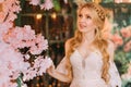 Portrait of young happy beautiful blonde woman in white vintage dress. Girl laughs smile on face. Studio background Royalty Free Stock Photo