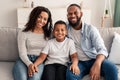 Portrait of young happy black family smiling at home Royalty Free Stock Photo