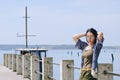 Portrait of young happy brunette woman in sunglasses relaxing at the seaside, beach at Adriatic sea. Summer vacation. Travel Royalty Free Stock Photo