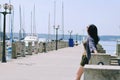 Portrait of young happy brunette woman in sunglasses relaxing at the seaside, beach at Adriatic sea. Summer vacation. Travel Royalty Free Stock Photo