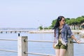 Portrait of young happy brunette woman in sunglasses relaxing at the seaside, beach at Adriatic sea. Summer vacation. Travel Royalty Free Stock Photo