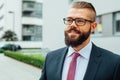 Portrait of a young happy businessman outside the office buildin Royalty Free Stock Photo