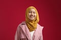 Portrait of young happy confident muslim teenage girl wearing hijab looking at camera and smiling cheerfully Royalty Free Stock Photo