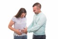 Portrait of young happy couple holding pregnant belly Royalty Free Stock Photo