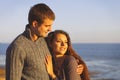 Portrait of young happy couple laughing in a cold day by the aut Royalty Free Stock Photo