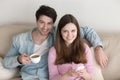 Portrait of young happy couple, relaxing indoors, enjoying coffe Royalty Free Stock Photo