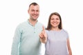 Portrait of young happy couple showing number one with finger Royalty Free Stock Photo