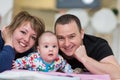 Portrait of young happy couple with their adorable baby boy Royalty Free Stock Photo