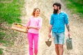 Portrait of a young happy couple in yard during spring season. Small business owner selling organic fruits and Royalty Free Stock Photo