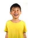 Portrait of young happy and excited child smiling and laughing cheerful wearing yellow t-shirt isolated on white background in kid Royalty Free Stock Photo