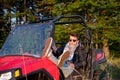 Portrait of young man driving a off road buggy car Royalty Free Stock Photo