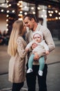 Portrait of family standing together in cosiness atmosphere.