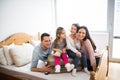 Young family with two children packing for holiday. Royalty Free Stock Photo