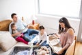 Young family with two children packing for holiday. Royalty Free Stock Photo