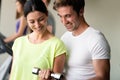 Portrait of a young happy fit woman with dumbbells Royalty Free Stock Photo