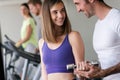 Portrait of a young happy fit woman with dumbbells Royalty Free Stock Photo