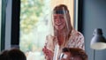 Portrait of young happy gen-z blonde leader business woman wearing face shield at office while leading team seminar. Royalty Free Stock Photo