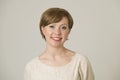 Portrait of young happy and pretty red hair woman on her 30s in sweet smile and positive face expression looking to camera isolate