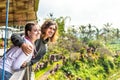 Portrait of young and happy romantic couple in balinese nature. Bali island.