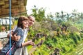 Portrait of young and happy romantic couple in balinese nature. Bali island.