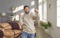 Portrait of a young happy smiling attractive man with keys in his hands. Royalty Free Stock Photo