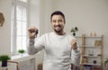 Portrait of a young happy smiling attractive man with keys in his hands. Royalty Free Stock Photo