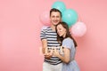 Portrait of young happy smiling couple in love. Woman lean on one`s man chest celebrating birthday holiday party on Royalty Free Stock Photo