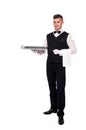 Portrait of young happy smiling waiter with on tray isolated on Royalty Free Stock Photo